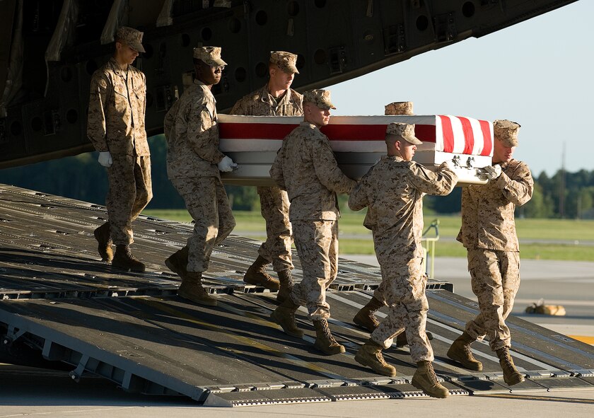 14 August 2010  USAF Photo by Jason Minto.  A U.S. Marine Corps carry team transfers the remains of Marine Cpl Kristopher D. Greer of Ashland City, TN., at Dover Air Force Base, Del., August 14, 2010.