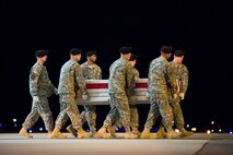 A U.S. Army carry team transfers the remains of Army Pfc. Bradley D. Rappuhn, of Grand Ledge, Mich., at Dover Air Force Base, Del., August 9. Pfc. Rappuhn was assigned to the 3rd Battalion, 75th Ranger Regiment, Fort Benning, Ga. (U.S. Air Force photo/Roland Balik)
