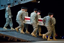 A U.S. Army carry team transfers the remains of Army Sgt. Andrew C. Nicol, of Kensington, N.H., at Dover Air Force Base, Del., August 9. Sgt. Nicol was assigned to the 3rd Battalion, 75th Ranger Regiment, Fort Benning, Ga.  (U.S. Air Force photo/Roland Balik)