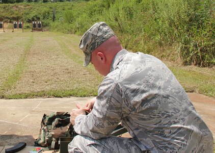 First Lt. Karl Kappler, 689th Combat Communications Wing loads a clip for an AK47 during the field striping portion of the AK-47 familiarization class held by the 689th CCW Aug. 20.
This opportunity was hosted off base in conjunction with the Warner Robins Police Department, a partner of Robins Air Force Base. Members were taught basic functionality, history and weapon specifications, they were also provided with a hands-on field striping and range opportunity.  "Today combat communications Airmen were able to place something else into their combat-readiness tool box, we are looking forward to the next familiarization class," said Capt. Josh Aultman, the class instructor. (US Air Force photo by Capt. Josh Aultman)
