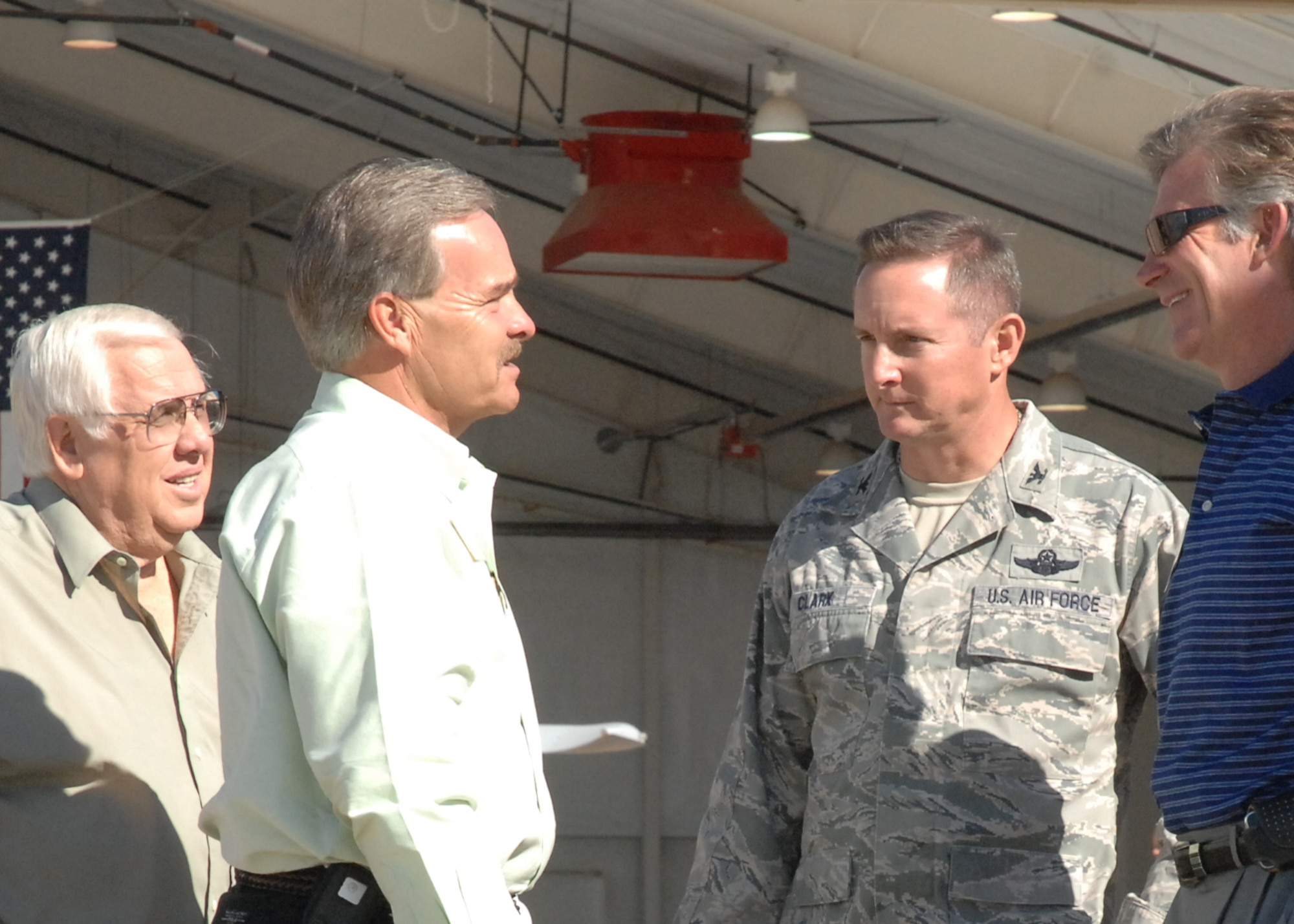Col. Stephen Clark, 27th Special Operations Wing commander, talks with members of the Committee of 50 during a tour August 26. The committee, the military affairs committee of nearby Clovis, N.M., was given the tour to showcase the mission of the 27 SOW. (U.S. Air Force photo/Senior Airman Elliott Sprehe)