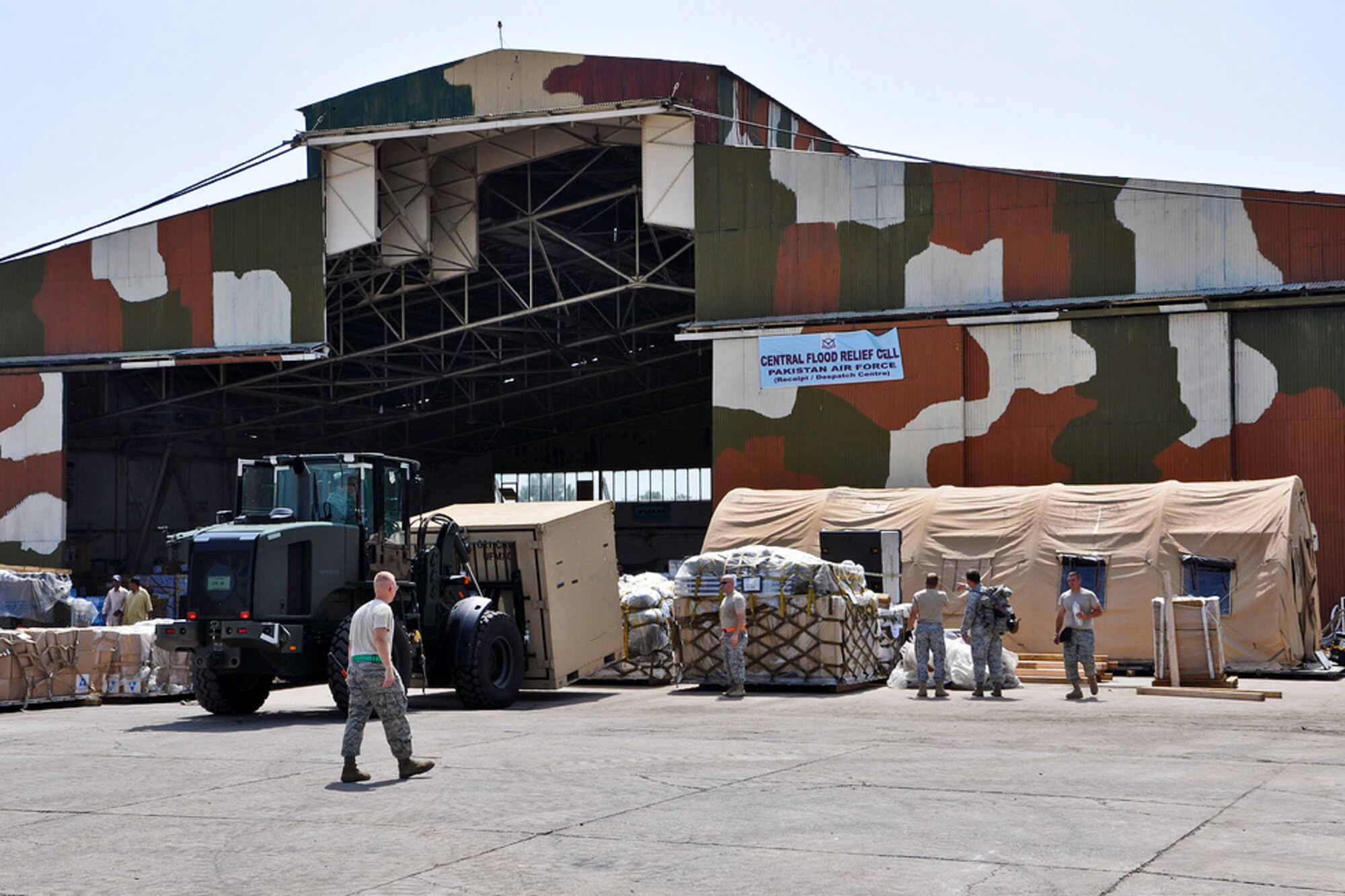 Airmen from the 621st Contingency Response Wing place equipment and prepare to establish operations with the Pakistan air force's central flood relief cell in Rawalpindi, Pakistan, Aug. 29, 2010. About 40 airmen assigned to the 621st CRW are working with Pakistani officials to support humanitarian airlift operations and deliver relief supplies to locations throughout Pakistan. (U.S. Air Force photo/Lt. Col. Patrick Ryder)