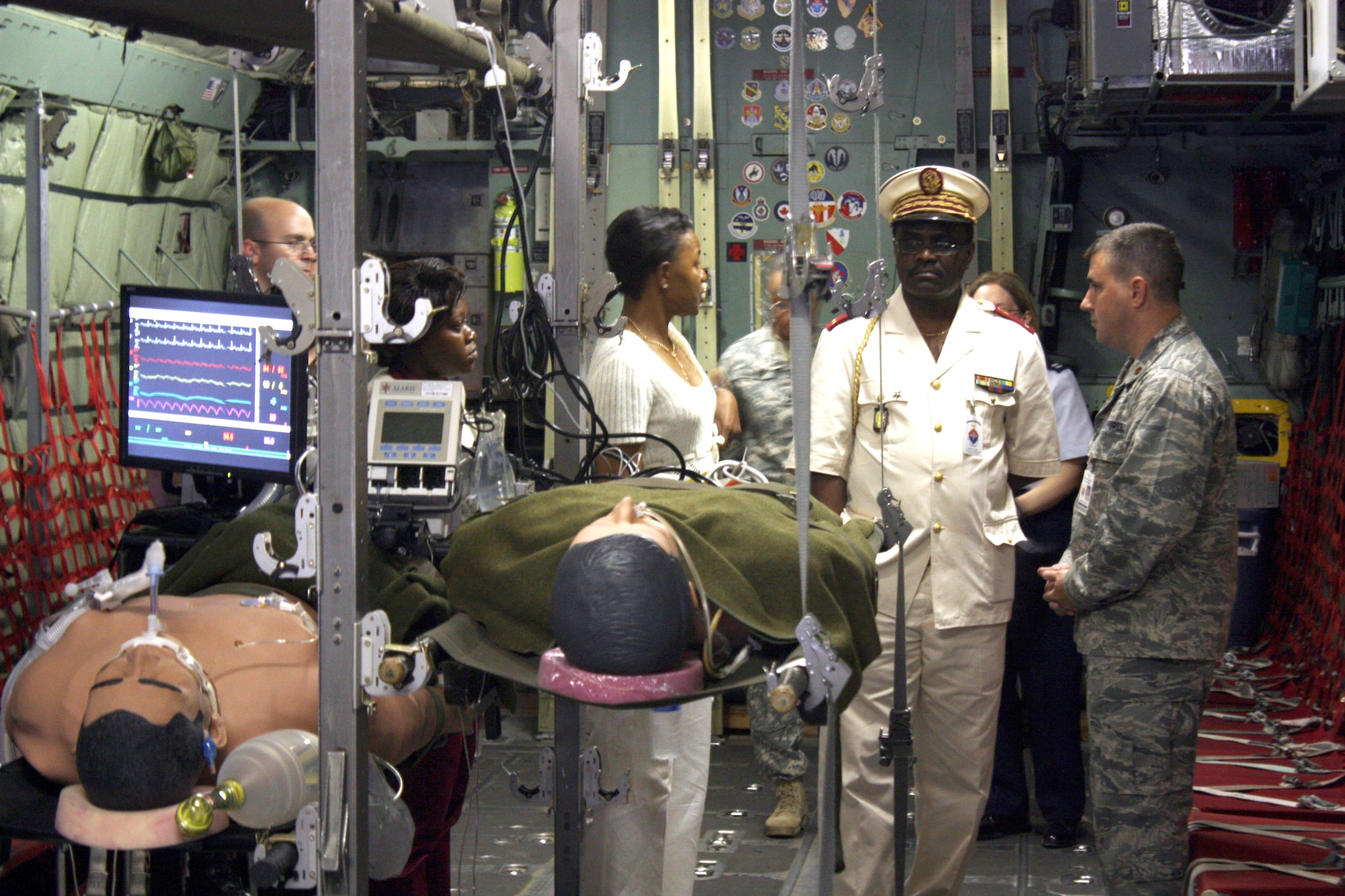 Brigadier General Tchoua, Deputy Director of Military Health Services in Gabon, Africa receives a tour and briefing of the C-130 Aeromedical Evacuation simulator from Maj. Jerry Rumbach, Instructor at the USAF School of Aerospace Medicine (USAFSAM).  During his visit to Brooks City-Base, TX, the general visited and received briefings on the wide range of courses offered to international students at USAFSAM. (Photo by: Amy Velasquez, USAFSAM/EDD)