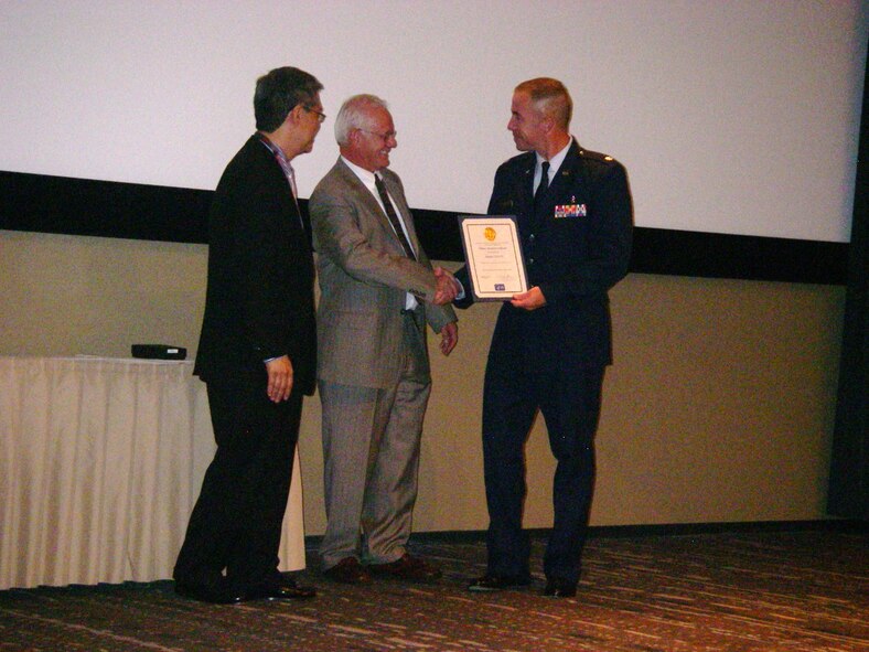 (Left to Right ) Dr. Phillip Nakano, son of Dr. James H Nakano, and Dr. Thomas Hearn, Acting Director, National Center for Emerging and Zoonotic Infectious Diseases present the James H. Nakano Citation to Lt Col (Dr.) Mark Duffy at an awards ceremony on Tuesday Aug 24.  The award ceremony was held at the Centers for Disease Control and Prevention (CDC) in Atlanta, Georgia.  Lt Col Mark Duffy of the USAF School of Aerospace Medicine received the citation for the paper Zika Virus Outbreak on Yap Island, Federated States of Micronesia published in the New England Journal of Medicine (June 11, 2009).  (Air Force Photo)