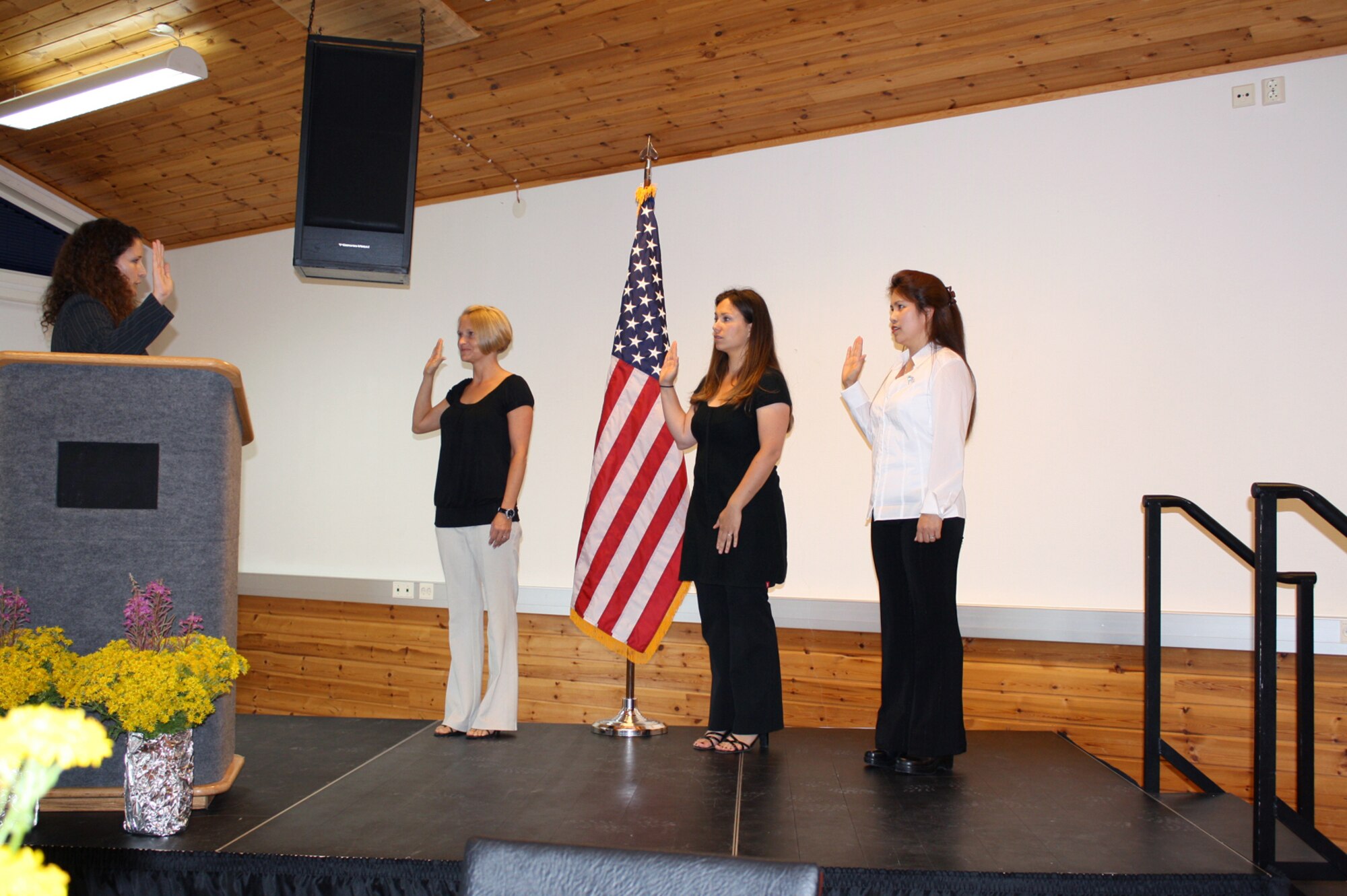 Three U.S. military spouses gained U.S. citizenship Aug. 19, 2010 during a naturalization services ceremony in Stavanger, Norway. Andrea Rodriguez-Sanchez, Rowena Jarman and Cornelia Jude are accompanying their spouses at the NATO Joint Warfare Center and the 426th Air Base Squadron.