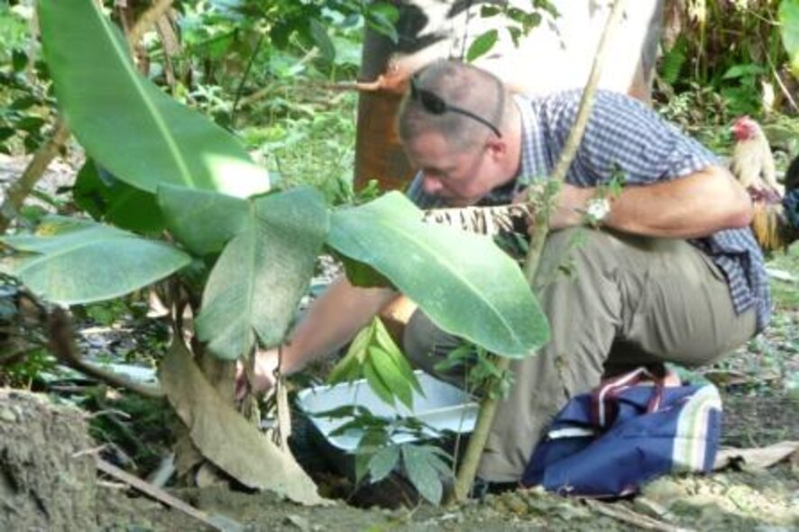 Lt Col (Dr.) Mark Duffy,  Chief Operational Support Section of the Epidemiology Consult Service with the USAF School of Aerospace Medicine (USAFSAM) conducts an investigation of the mosquito population during an outbreak of Zika virus on Yap Island. The virus was likely transmitted by mosquitoes. His paper on the investigation was recognized by the National Center for Emerging and Zoonotic Infectious Diseases (NCEZID) division of the Centers for Disease Control (CDC) as an outstanding paper in the field of assessment in epidemiology on Aug 24, 2010.    (Air Force Photo)
