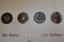 The entrance to the Center for Families of the Fallen displays the seals of the four services. (U.S. Air Force photo/Senior Airman Jonathan Young) 