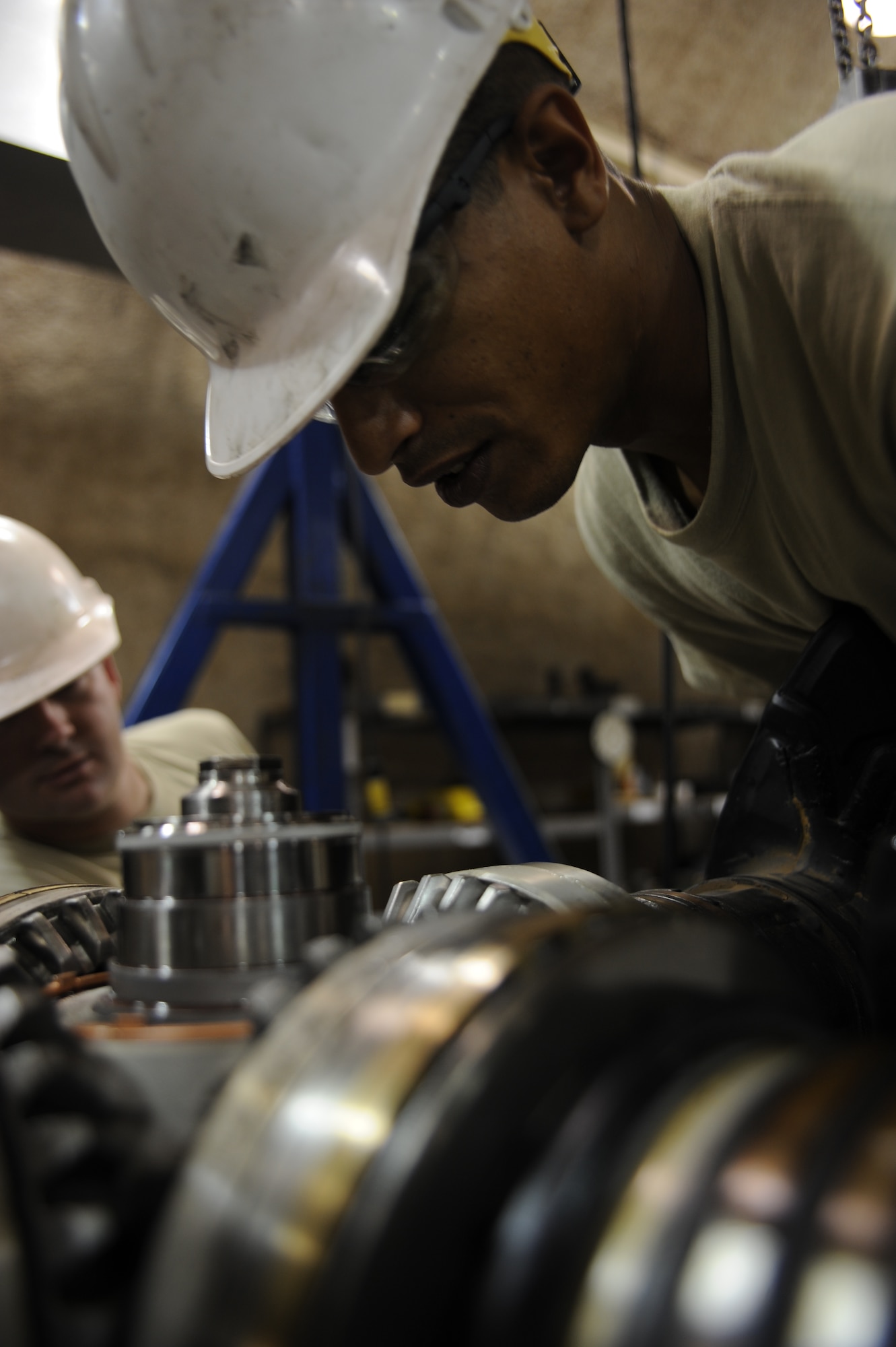 Senior Airman Aaron Arnold installs a C-130 propeller blade at an undisclosed location in Southwest Asia Aug. 30. Airman Arnold is a jet engine mechanic with the 379th Expeditionary Maintenance Squadron and is deployed from Little Rock AFB, Ark. (U.S. Air Force photo/Senior Airman Katie Gieratz)