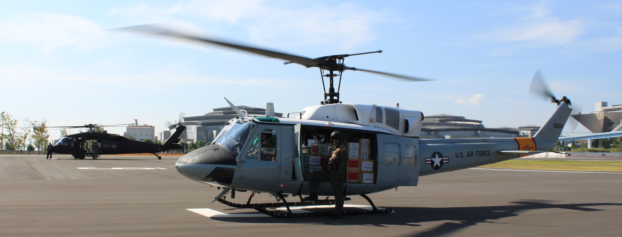 YOKOTA AIR BASE, Japan -- A Yokota UH-1 waits to offload supplies in downtown Tokyo, 29 Aug, as part of the Tokyo Metropolitan Government's Comprehensive Disaster Management Drill. The TMG drill consisted of loading supplies into helicopters at various U.S. and Japanese military and civilian staging areas, and unloading them at a single, central location, demonstrating the interoperability between the different agencies of the U.S. and Japanese governments. (courtesy photo)