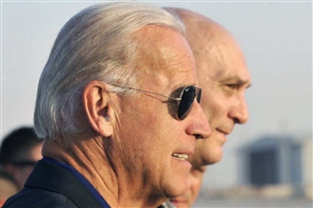U.S. Vice President Joe Biden, left, and U.S. Army Gen. Raymond T. Odierno, commander of U.S. Forces Iraq, walk to a waiting helicopter after arriving on Sather Air Base, Iraq, Aug. 30, 2010. Biden is  taking part in a change of command ceremony as Odierno is relieved by U.S. Army Lt. Gen. Lloyd J. Austin III. The ceremony also marks the start of Operation New Dawn, when U.S. forces will move from combat to stability operations.