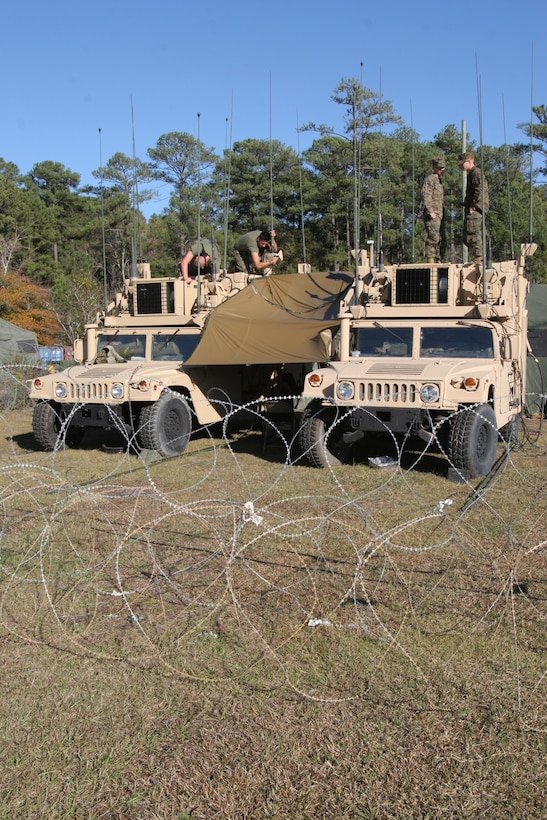 Marines of Marine Air Support Squadron 1 prepare their communications equipment Dec. 1 at Marine Air Control Group 28’s headquarters building prior to the Marine Air Command and Control System Integrated Simulated Training Exercise.