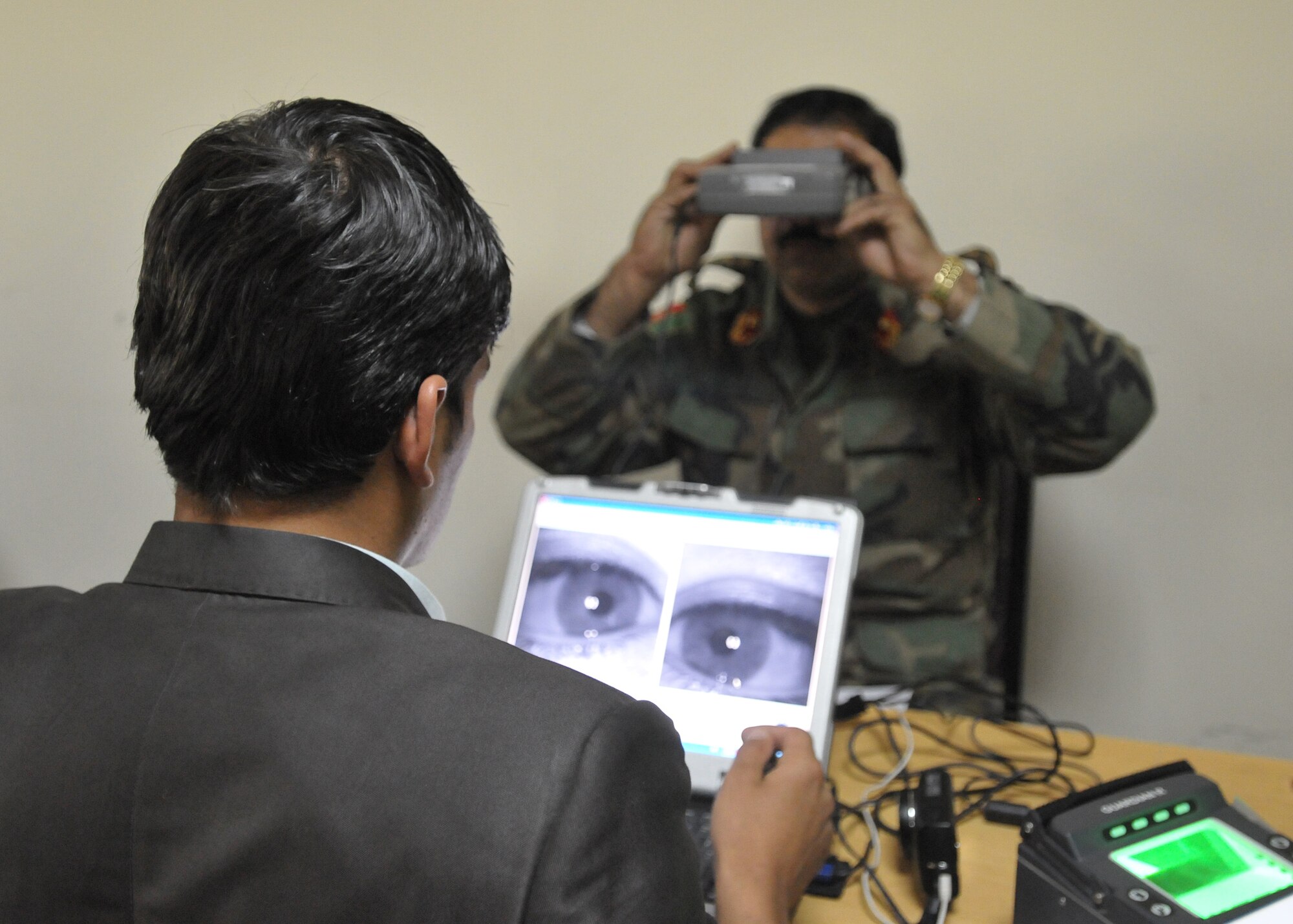 KABUL, Afghanistan – Afghan Air Force Airmen and civilian contractors perform Personnel Accountability Inventory incorporating a Biometrics component to strengthen force accountability and enhance force protection for AAF and Coalition partners Nov. 29 at the Afghan Air Force Base in Kabul, Afghanistan. (US Navy photo by MC2 Vladimir Potapenko/RELEASED).