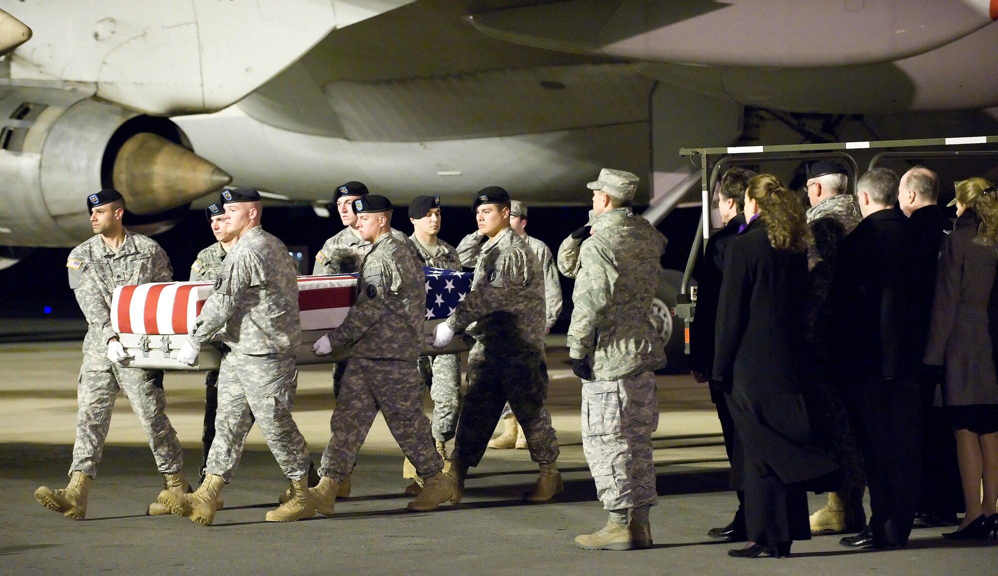 A U.S. Army carry team transfers the remains of Army Pvt. Buddy W. McLain of Mexico, Maine., at Dover Air Force Base, Del., Dec. 1, 2010.  McClain assigned to the 1st Squadron, 61st Cavalry Regiment, 4th Brigade Combat Team, 101st Airborne Division (Air Assault), Fort Campbell, Ky. (U.S. Air Force photo by Jason Minto)
