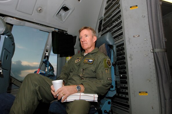 Lt. Gen. Herbert "Hawk" Carlisle, 13th Air Force commander, enjoys a morning cup of coffee at Joint Base Pearl Harbor Hickam while crew members go through pre-flight procedures for his final flight as the 13th Air Force commander Nov. 30. General Carlisle's final flight was supported by the 15th Wing's 535th Airlift Squadron here. General Carlisle has been confirmed for assignment as Deputy Chief of Staff, Operations, Plans and Requirements, Headquarters U.S. Air Force, Washington, D.C. (U.S. Air Force photo by Mark Bates)