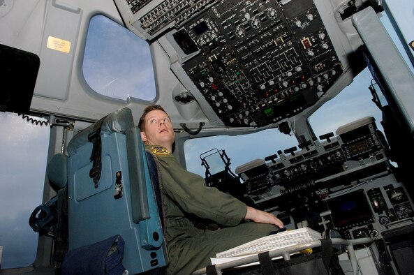 Maj. Scott Raleigh, 13th Air Force C-17 Standards and Evaluations program chief, performs a pre-flight inspection at Joint Base Pearl Harbor Hickam, Hawaii before Lt. Gen. Herbert "Hawk" Carlisle's final flight as the 13th Air Force commander Nov. 30. General Carlisle's final flight was supported by the 15th Wing's 535th Airlift Squadron. General Carlisle has been confirmed for assignment as Deputy Chief of Staff, Operations, Plans and Requirements, Headquarters U.S. Air Force, Washington, D.C. (U.S. Air Force photo by Mark Bates)