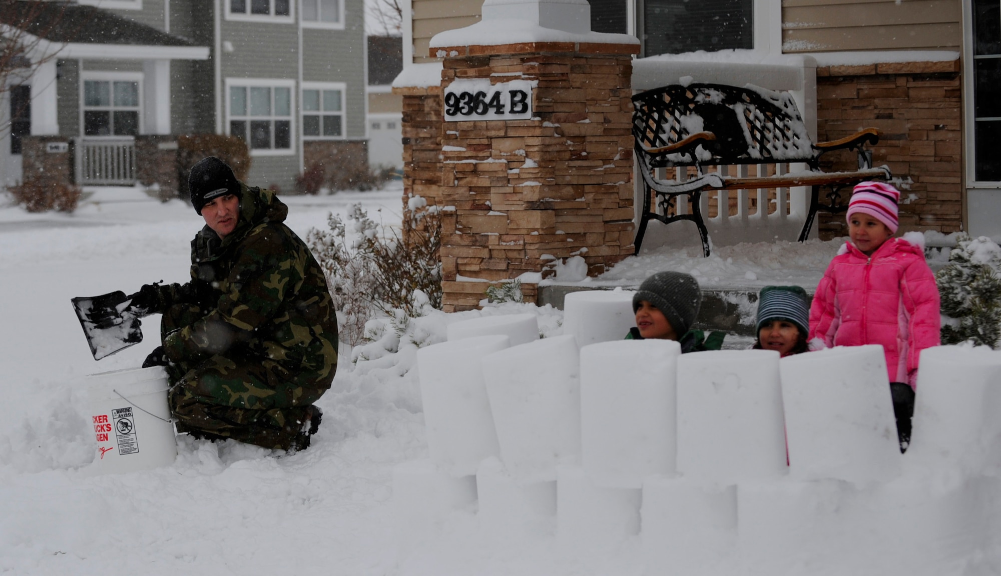 MOUNTAIN HOME AIR FORCE BASE, Idaho -- Staff Sgt. Brandon Moxley, 366th Control Maintenance Squadron hydraulic systems craftsman, builds a fort with his children Dec. 1. Due to the inclement weather and bad road conditions schools on base and in town were canceled today. (U.S. Air Force photo by Senior Airman Renishia Richardson)
