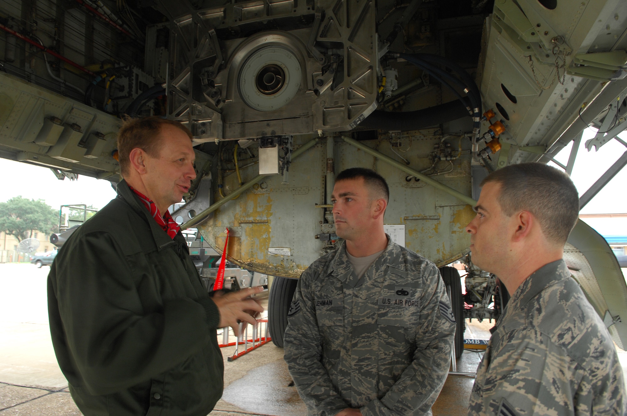 BARKSDALE AIR FORCE BASE, La. -- Lt. Gen. Paul Fouilland, French Strategic Air Forces commander-in-chief, discusses aspects of the B-52 bomber with 2nd Aircraft Maintenance Squadron crew chiefs, Staff Sgt. Matthew Lehman and Senior Airman Matthew Dennis, during his visit to Air Force Global Strike Command at Barksdale Air Force Base, La., Nov. 14 – 18.  The visit and meetings were designed to develop mutual understanding and partnering opportunities. (U.S. Air Force photo/Master Sgt. Corey A. Clements)
