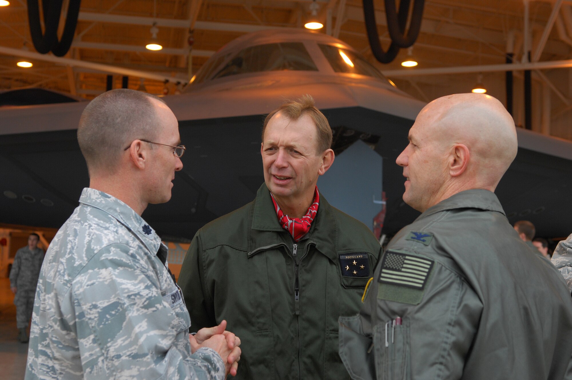 BARKSDALE AIR FORCE BASE, La. -- Lt. Col. Matthew Synder (left), 509th Maintenance Operations Squadron commander from Whiteman Air Force Base, Mo. and Col. Gregory Smith, Air Force Global Strike Command Requirements and Policy deputy director, discuss the maintenance mission for the B-2 bomber with Lt. Gen. Paul Fouilland, (center), commander-in-chief, French Strategic Air Forces, during his recent visit to AFGSC at Barksdale AFB, La. Nov. 14 – 18.  (U.S. Air Force photo/Master Sgt. Corey A. Clements)