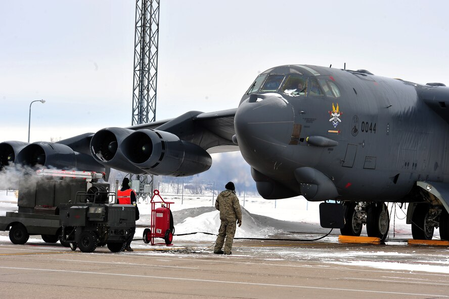 MINOT AIR FORCE BASE, N.D. -- Member of the 5th Aircraft Maintenance Squadron, communicate with aircrew member of a B-52H Stratofortress prior to launch here Dec. 1. Maintenance on these aircrafts is essential in keeping Air Force Global Strike Command’s assets combat ready 24/7 worldwide. (U.S. Air Force photo/Senior Airman Michael J. Veloz)