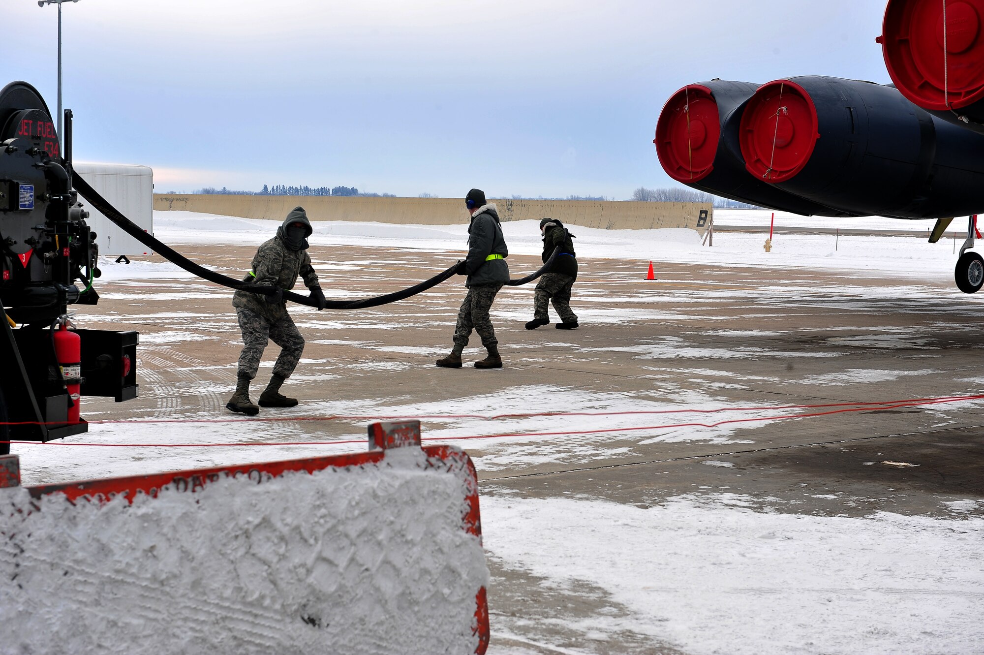 MINOT AIR FORCE BASE, N.D. -- Member of the 5th Aircraft Maintenance Squadron, prepare to fuel a B-52H Stratofortress here Dec. 1. Maintenance on these aircrafts is essential in keeping Air Force Global Strike Command’s assets combat ready 24/7 worldwide. (U.S. Air Force photo/Senior Airman Michael J. Veloz)
