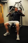 MINOT AIR FORCE BASE N.D. -- 1st Lt. Justin Shetter, 5th Aircraft Maintenance aircraft maintenance unit officer in charge, weight trains at the McAdoo Fitness Center here Dec. 1. Exercising is a great way to fight weight gain during the cold weather season. (U.S. Air Force photo/Airman 1st Class Aaron-Forrest Wainwright)
