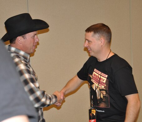 Master Sgt. Brian Paavo, the Air Force In-Service Recruiter, shakes hands with Rodney Carrington before his concert on Nov. 30 at the Dena'Ina Civic Center in Anchorage, AK. Carrington's show was part of the Air Force Reserve's Tour for the Troops 2010.
