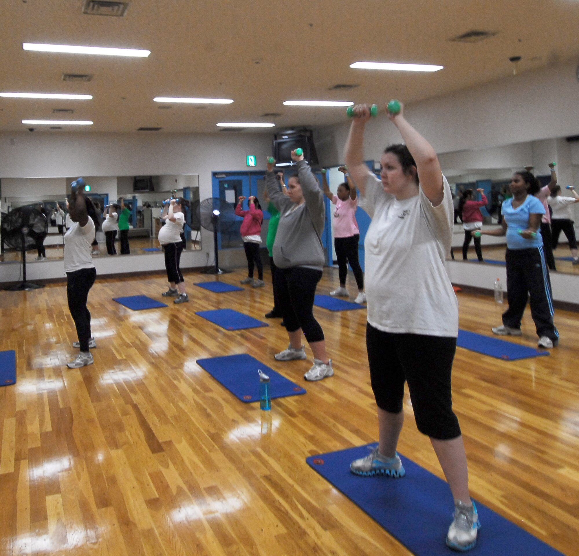 Staff Sgt. Treshawna Gwendo leads moms-to-be during the Fit Moms class Nov. 21, 2010, at Yakota Air Base, Japan. Sergeant Gwendo is a diet therapist at the 374th Aerospace Medicine Squadron. (U.S. Air Force photo/Airman 1st Class Lynsie Nichols)