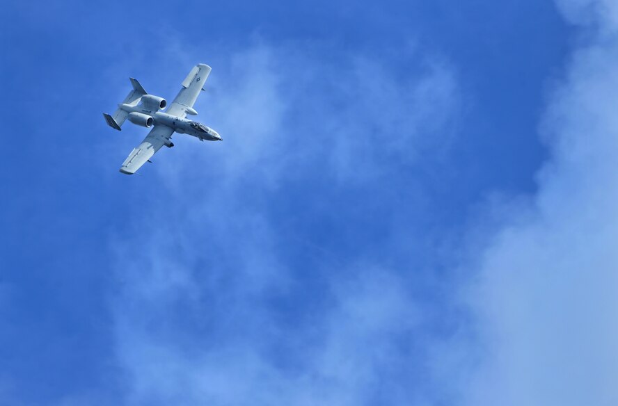 MOODY AIR FORCE BASE, Ga.-- Maj. Dylan Thorpe, A-10 East Demonstration Team pilot, maneuvers an A-10C Thunderbolt II through partly cloudy and blue skies during his certification flight Nov. 30. The team showcased their abilities to the wing commander during the certification flight so they could move on for certification at the 9th Air Force level. (U.S. Air Force photo/Airman 1st Class Joshua Green)(RELEASED)
