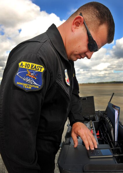 MOODY AIR FORCE BASE, Ga.-- Tech. Sgt. Matt Harris, A-10 East Demonstration Team assistant team chief, prepares the music and microphone before a certification flight for Maj. Dylan Thorpe Nov. 30. Sergeant Harris is the master of ceremonies for the A-10 Demo team and provides information about what maneuvers are being performed as well as the small history facts about the A-10C Thunderbolt II. (U.S. Air Force photo/Airman 1st Class Joshua Green)(RELEASED)
