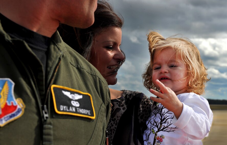 MOODY AIR FORCE BASE, Ga.-- Brooklyn Thorpe, daughter of Maj. Dylan Thorpe, A-10 East Demonstration Team pilot, pulls off the rank of Captain on her daddy’s shoulders during a promotion ceremony Nov. 30. (U.S. Air Force photo/Airman 1st Class Joshua Green)(RELEASED)
