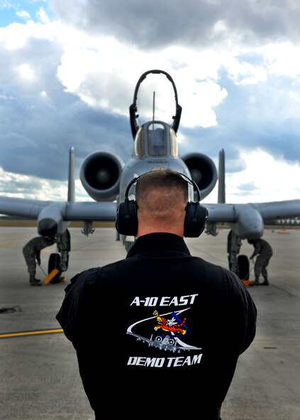 MOODY AIR FORCE BASE, Ga.--  An A-10 East Demonstration Team maintainer, guides in a A-10C Thunderbolt II into its parking space at the end of a certification flight Nov. 30. Moody's A-10 East Demonstration Team performs all over the world with a goal of showcasing the A-10C Thunderbolt II's extreme capabilities. (U.S. Air Force photo/Airman 1st Class Joshua Green)(RELEASED)
