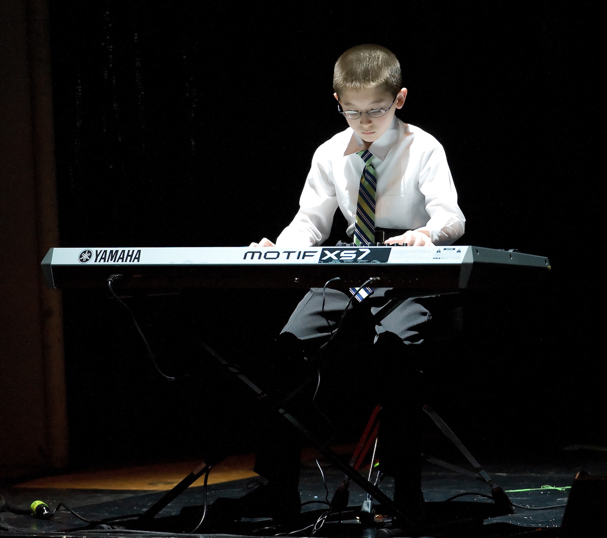 Andrew Bratcher, 11, opens for the Tops in Blue concert at Delaware State University Nov. 23, 2010, after earning the privilege by placing first in his age bracket in the Air Force "You Got Talent" competition. Andrew is the son of Perry and Noriko Bratcher. (U.S. Air Force photo by Jason Minto/Released)