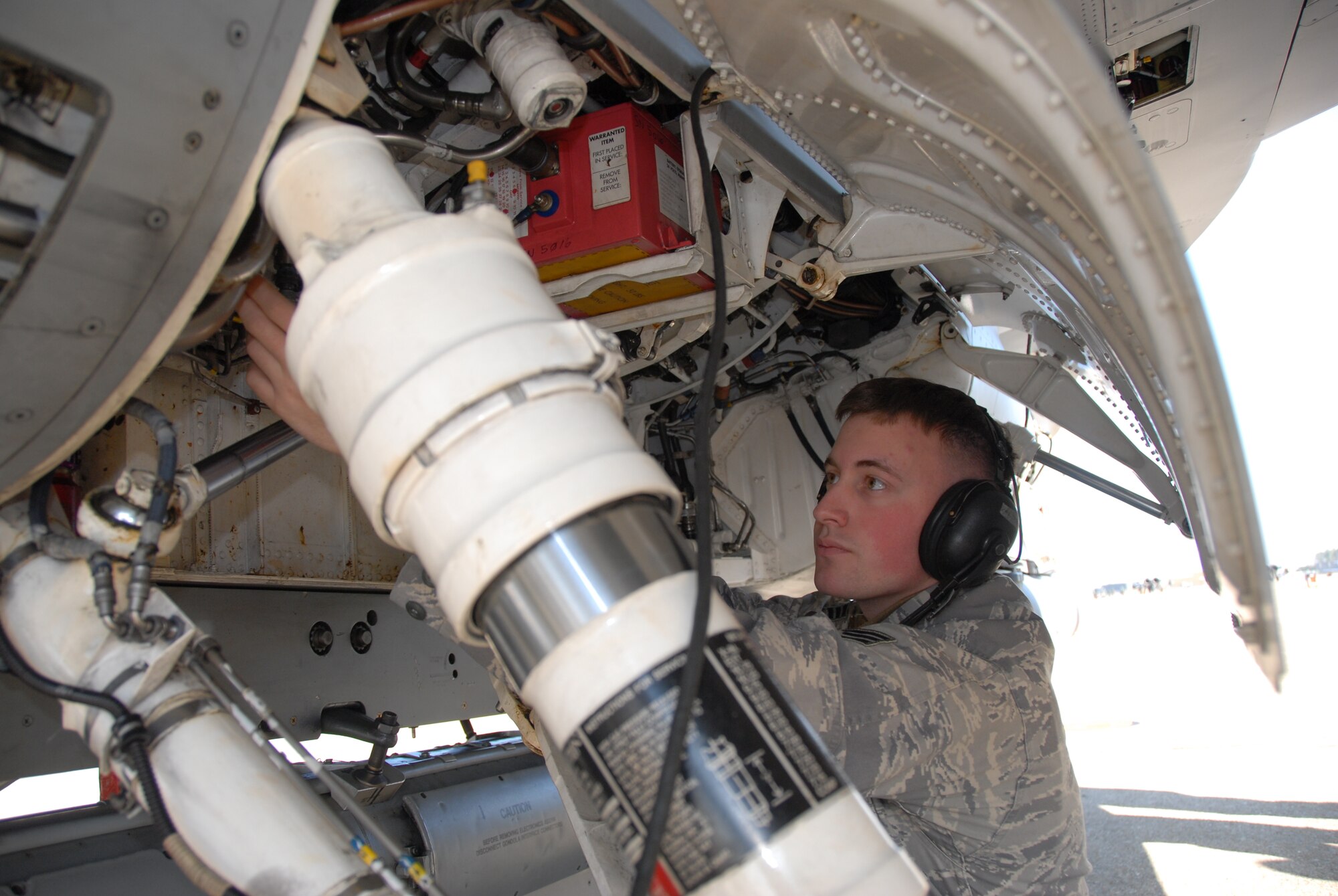 U.S. Air Force Senior Airman Clinton Smith, 35th Aircaft Maintenance Squadron avionics specialist, pins landing gear to an F-16 Eagle Fighting Falcon from Misawa Air Base, Japan, after the aircraft landed at Komatsu Air Base, Japan, on Dec. 1, 2010. The aircraft is one of 12 F-16s that arrived in support of exercise Keen Sword operations. Keen Sword 2011 is the tenth joint-bilateral field training exercise since 1986 involving Japan Self Defense Forces and United States military forces. (U.S. Air Force photo by 1st Lt. Cammie Quinn) 