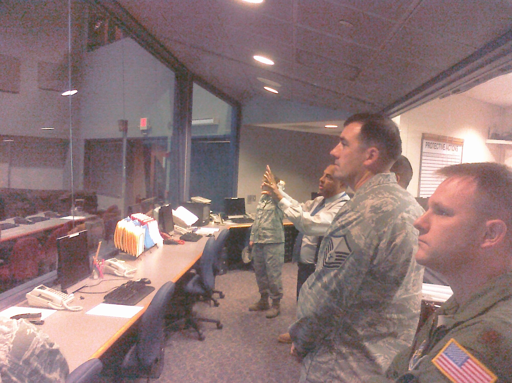 Dover Air Force Base, Del., Emergency Support Function members are briefed on the operations section of the Delaware Emergency Management Agency Emergency Operations Center; Nov. 17, 2010. (U.S. Air Force courtesy photo/Released)