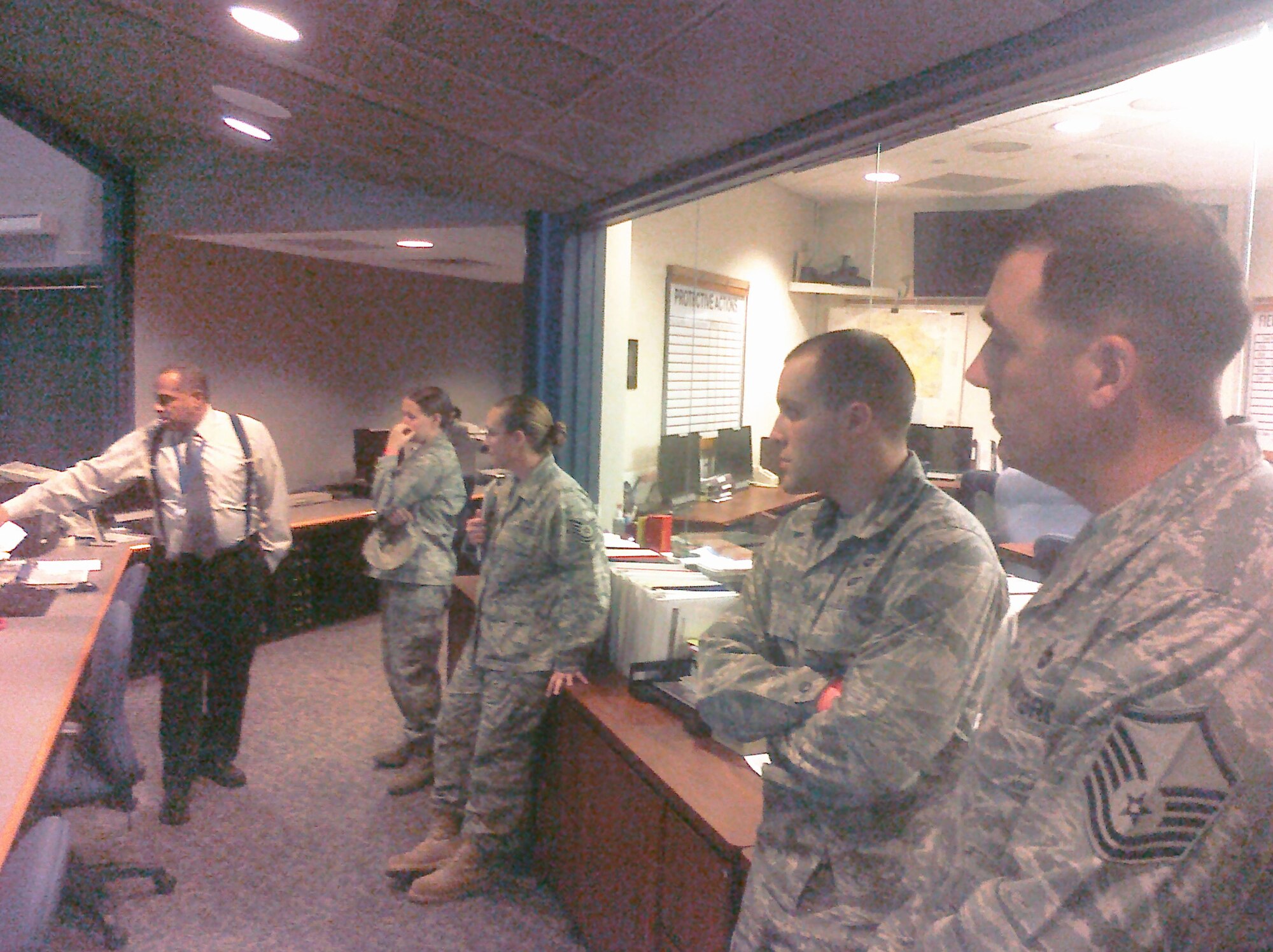 Dover Air Force Base, Del., Emergency Support Function members discuss operations capabilities Nov. 17, 2010, in the Delaware Emergency Management Agency Emergency Operations Center. (U.S. Air Force courtesy photo/Released)