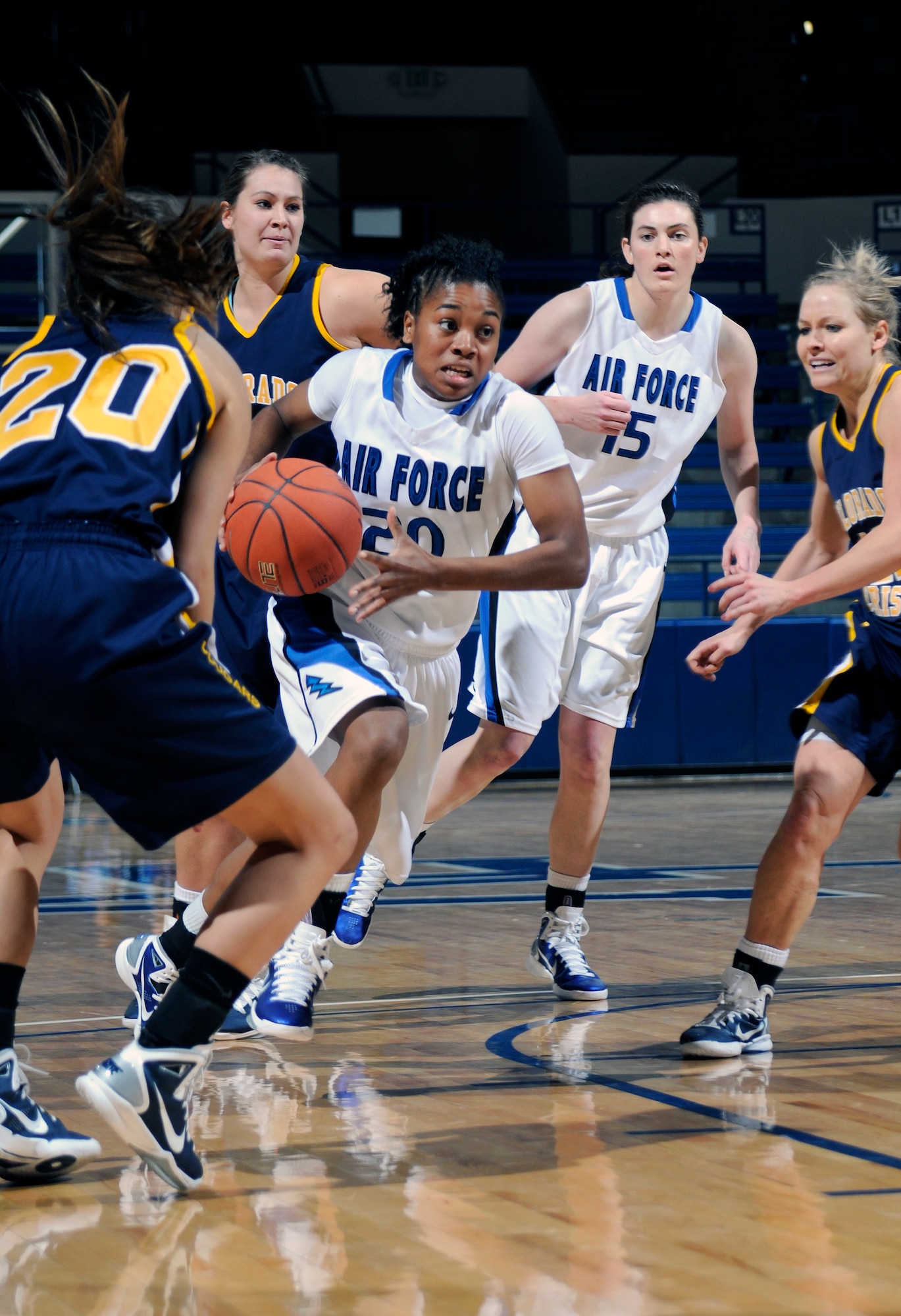 Freshman Camille Thompson drives in for a layup against the Colorado Christian defense during the Falcons' game against the Cougars at the Air Force Academy's Clune Arena Nov. 28, 2010. Thompson is a native of McDonough, Ga. (U.S. Air Force photo/Megan Davis)