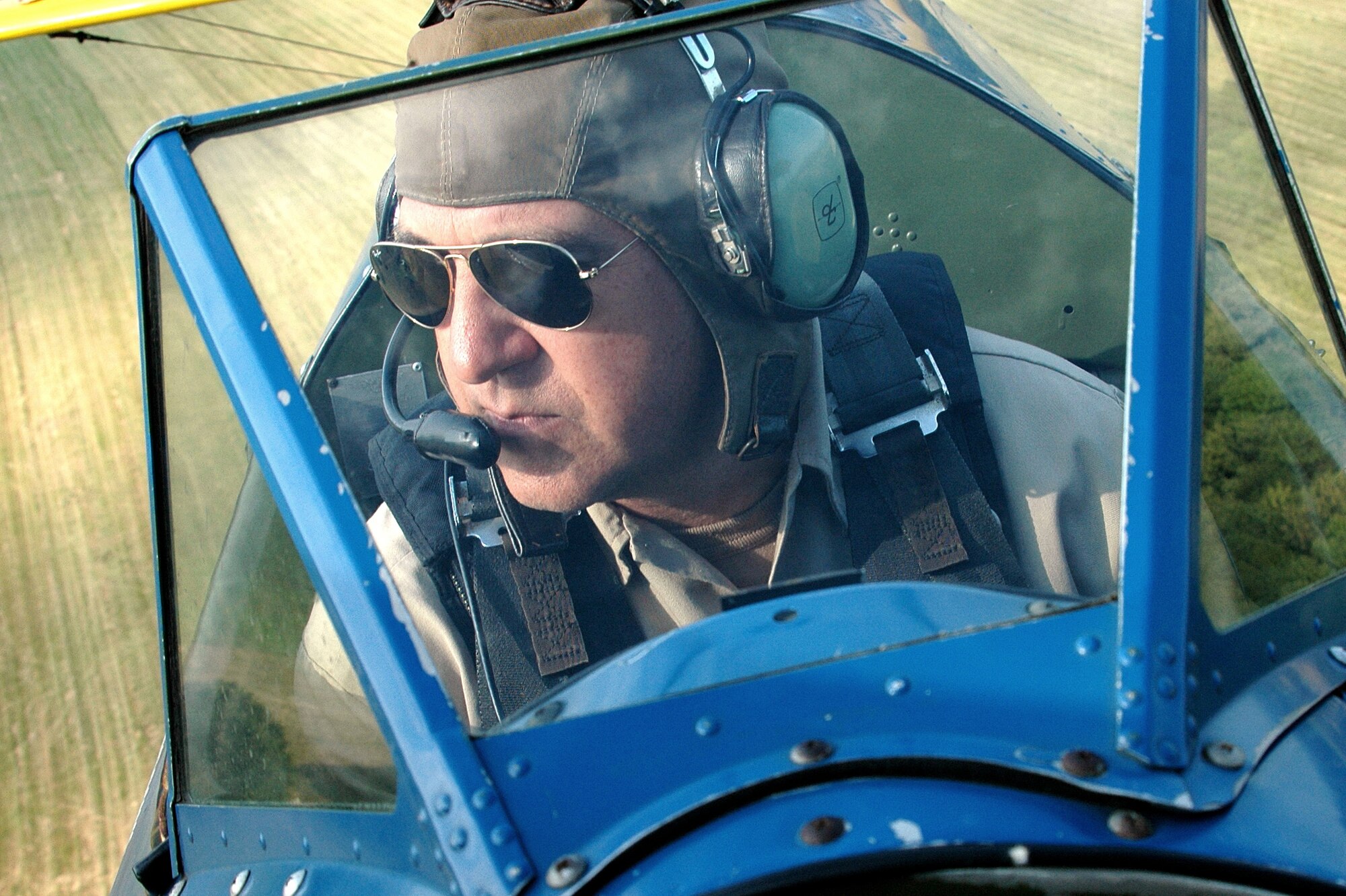 BEALETON, Va. -- Tech. Sgt. Dave Brown, 459th Aeromedical Evacuation Squadron medical material specialist flys his 1941 PT-17 Stearman over an open field here. When he's not performing his duties as an Air Force Reservist, Sergeant Brown performs aerobatic maneuvers for the Flying Circus air show and provides flight instruction through his business, Brown Aviation. (Submitted photo) 