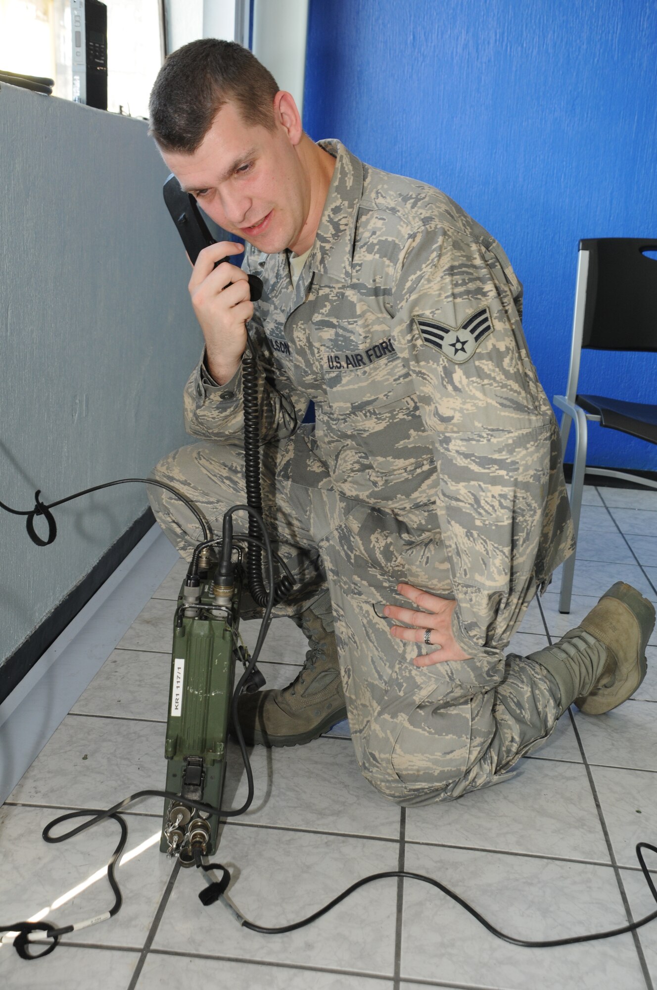GUATEMALA CITY, Guatemala --  Senior Airman Henry Tolson, who works with the J6 communications office at Soto Cano Air Base, Honduras, conducts a radio communications check with the forward deployed command post during a medical readiness training exercise here Nov. 30. Mission communications involves more than radios, though; servicemembers use computers, radios, phones and more to ensure a constant flow of timely information. On medical missions, communications is also necessary to ensure a quick response to medical evacuation requests. (U.S. Air Force photo/Tech. Sgt. Benjamin Rojek)