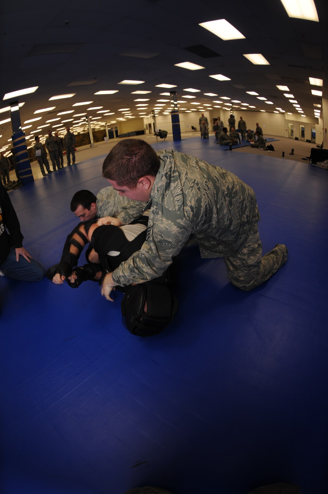 MINOT AIR FORCE BASE, N.D. -- Airmen from the 91st Missile Security Forces Squadron practice non-lethal combative training here Nov. 23. Non-lethal combative training is used to detain unarmed trespassers on Air Force Global Strike Command property. (U.S. Air Force photo/Airman 1st Class Aaron-Forrest Wainwright)