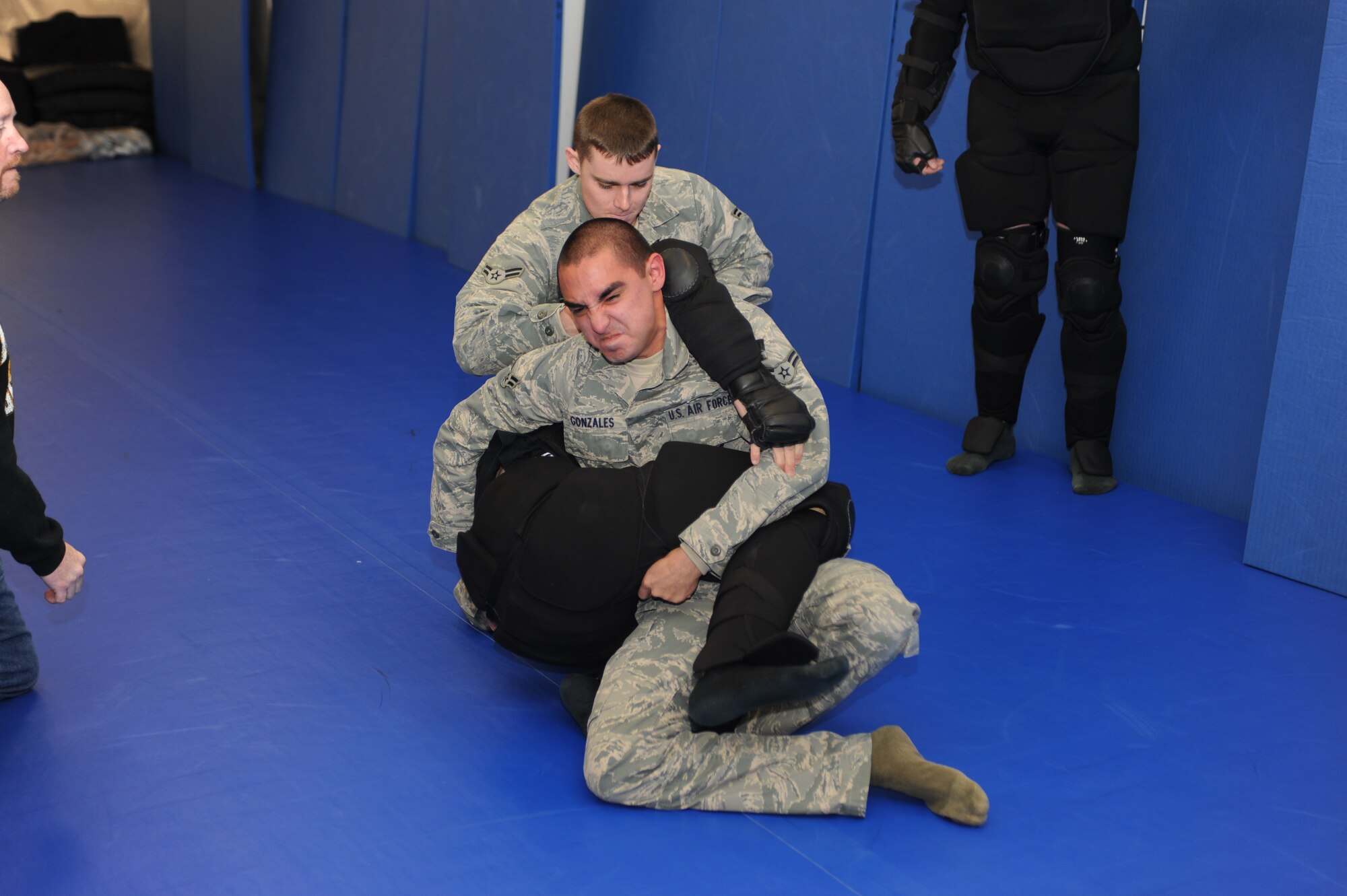 MINOT AIR FORCE BASE, N.D. -- Airman 1st Class Pete Gonzales, 91st Missile Security Forces Squadron, security forces member, practices non-lethal combative training with his wingman here Nov. 23. Non-lethal combative training is used to detain unarmed trespassers on Air Force Global Strike Command property. (U.S. Air Force photo/Airman 1st Class Aaron-Forrest Wainwright)