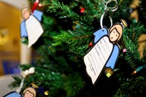 MINOT AIR FORCE BASE, N.D. -- Angels hang on the Christmas tree in the Exchange with holiday gift wishes from children of active duty members here Nov. 30. The angels on the tree are a significant part of Operation Angel Tree. (U.S. Air Force photo/Senior Airman Benjamin Stratton)