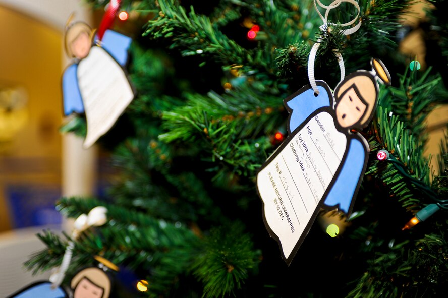 MINOT AIR FORCE BASE, N.D. -- Angels hang on the Christmas tree in the Exchange with holiday gift wishes from children of active duty members here Nov. 30. The angels on the tree are a significant part of Operation Angel Tree. (U.S. Air Force photo/Senior Airman Benjamin Stratton)