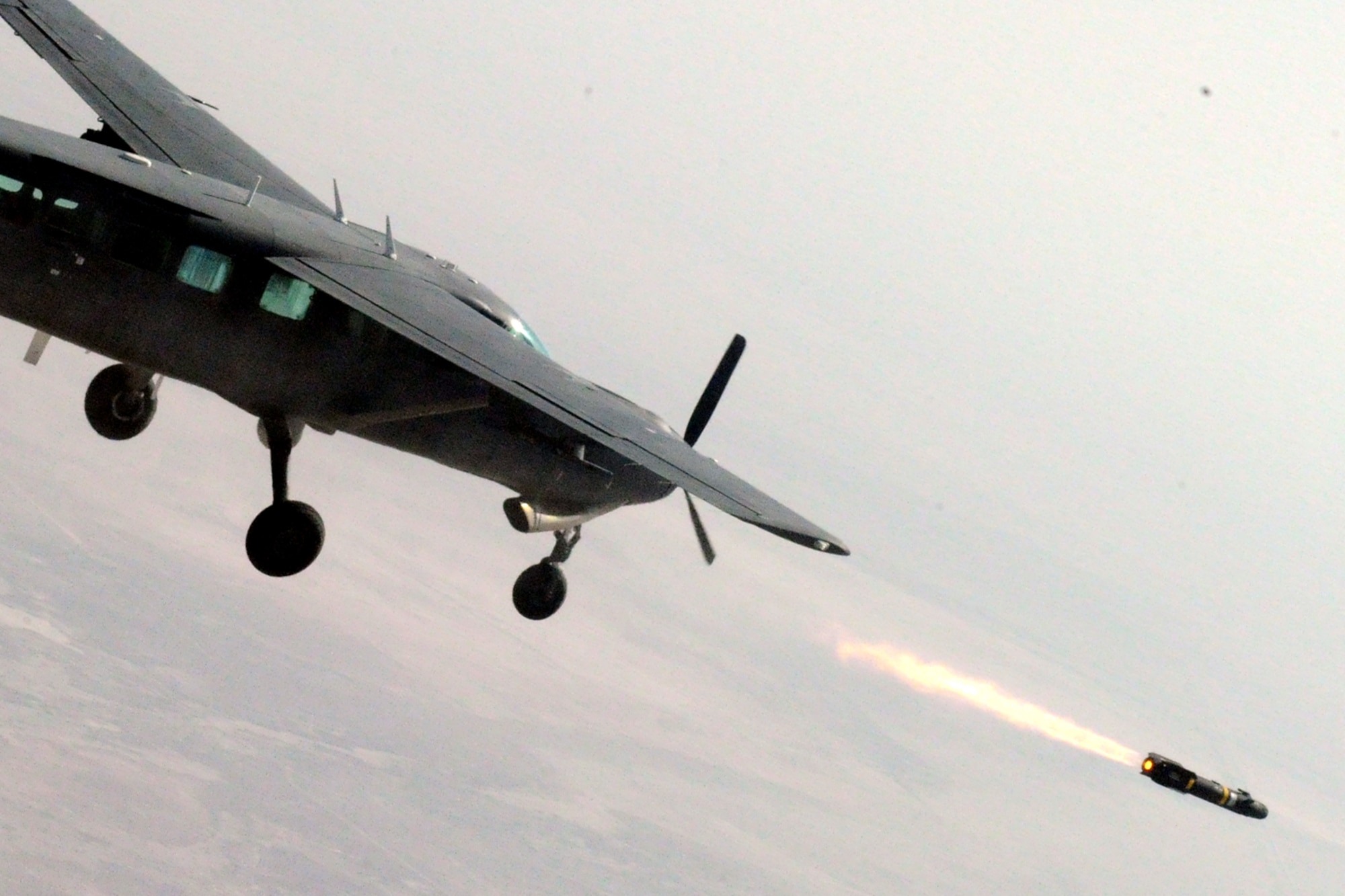 An Iraqi Air Force AC-208 Cessna Caravan aircrew launches a Hellfire missile at a target on the Aziziyah Training Range, south of Baghdad, Nov. 8, 2010.  The Iraqi Airmen scored a direct-hit, destroying the target in their second-ever launch of a Hellfire missile.  Iraqi Airmen have trained continuously for the Hellfire mission, mastering the weapons load, target attack and airmanship skills necessary to maintain proficiency since completing their first Hellfire launch in 2009, also resulting in a direct hit of a training target.  U.S. Air Force Air Advisors of the 521st Air Expeditionary Advisory Squadron at Kirkuk work shoulder-to-shoulder as partners in the effort.  (U.S. Army photo by SGT Brandon Bolick)