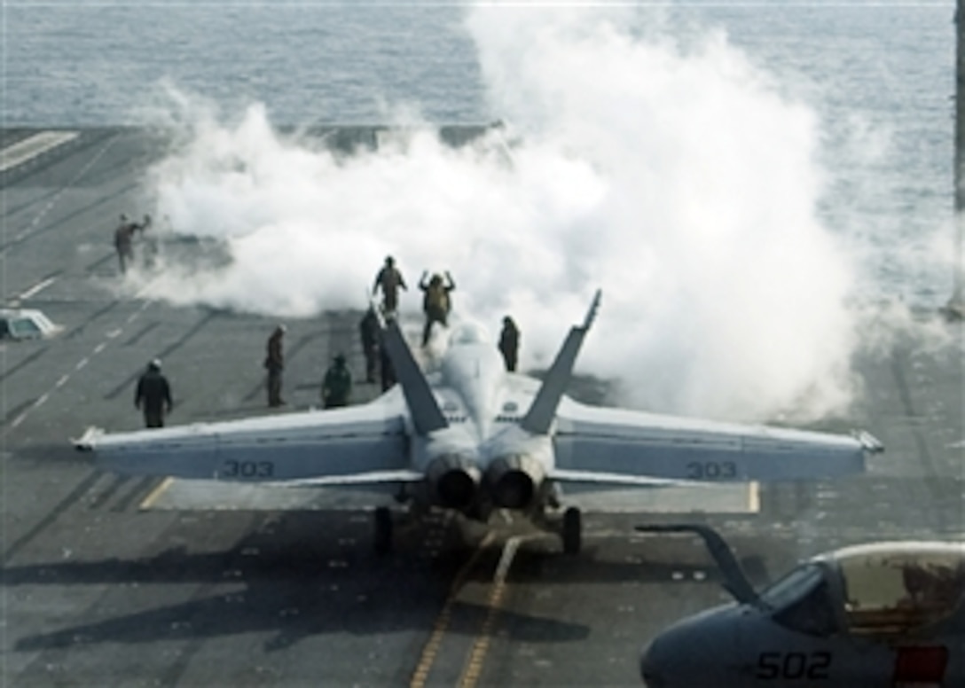 A U.S. Navy F/A-18 Hornet prepares to launch from the aircraft carrier USS George Washington (CVN 73) underway off the Korean peninsula on Nov. 29, 2010.  The George Washington was preparing for a training exercise with the Republic of Korea navy.  