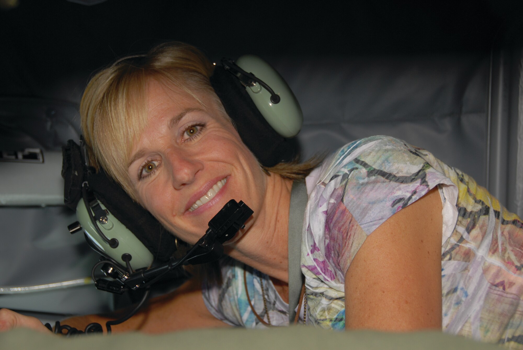 Mrs. Lisa Closen, wife of Col. David Closen, 442nd Operations Group commander, talks to her husband over the radio from a KC-135 while her husband refuels in an A-10 Thunderbolt II above Lake of the Ozarks, Missouri. The 442nd Operations Group  is part of the 442nd Fighter Wing, an Air Force Reserve unit at Whiteman Air Force Base, Mo. (U.S. Air Force photo/Staff Sgt. Danielle Wolf)