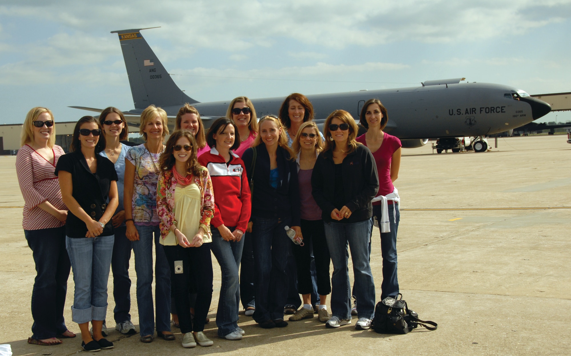 A-10 pilots' spouses prepare to board a KC-135 to watch an aerial A-10 refueling. The pilots are part of the 303rd Fighter Squadron of the 442nd Fighter Wing, an A-10 Thunderbolt II Air Force Reserve unit at Whiteman Air Force Base, Mo. (U.S. Air Force photo/Staff Sgt. Danielle Wolf)