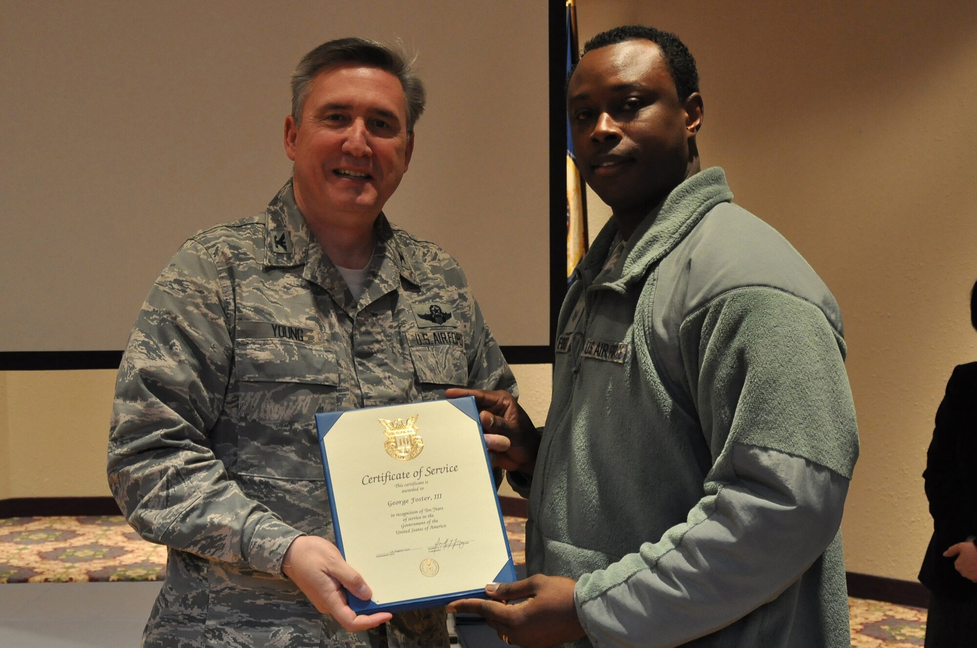 Colonol Darrell Young, 934th Airlift Wing Commander  presents 10 Service award to George Foster III (Air Force Photo/TSgt Bob 