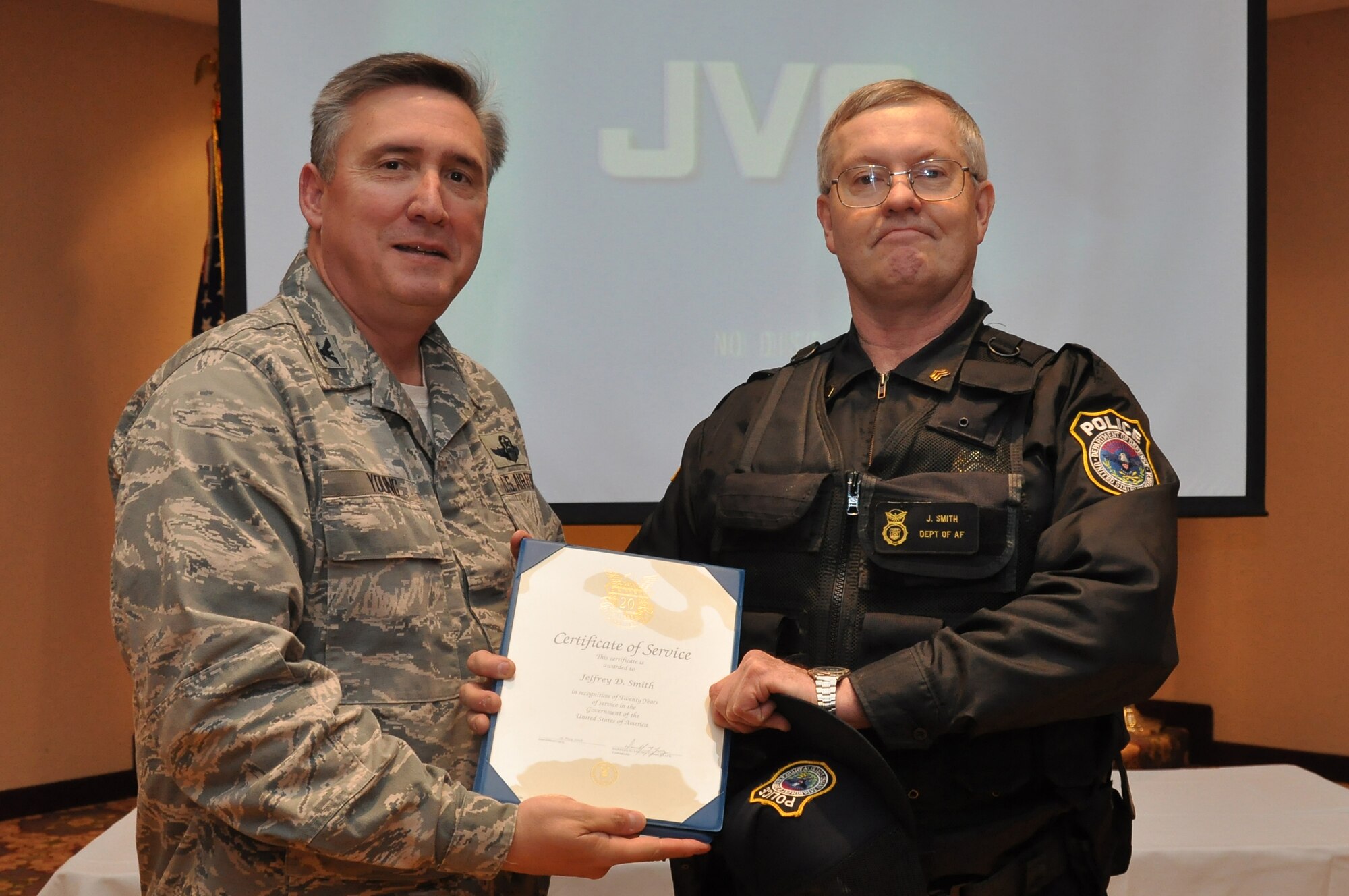 Colonol Darrell Young, 934th Airlift Wing Commander  presents 20 Service award to Jeffery Smith (Air Force Photo/TSgt Bob Sommer)