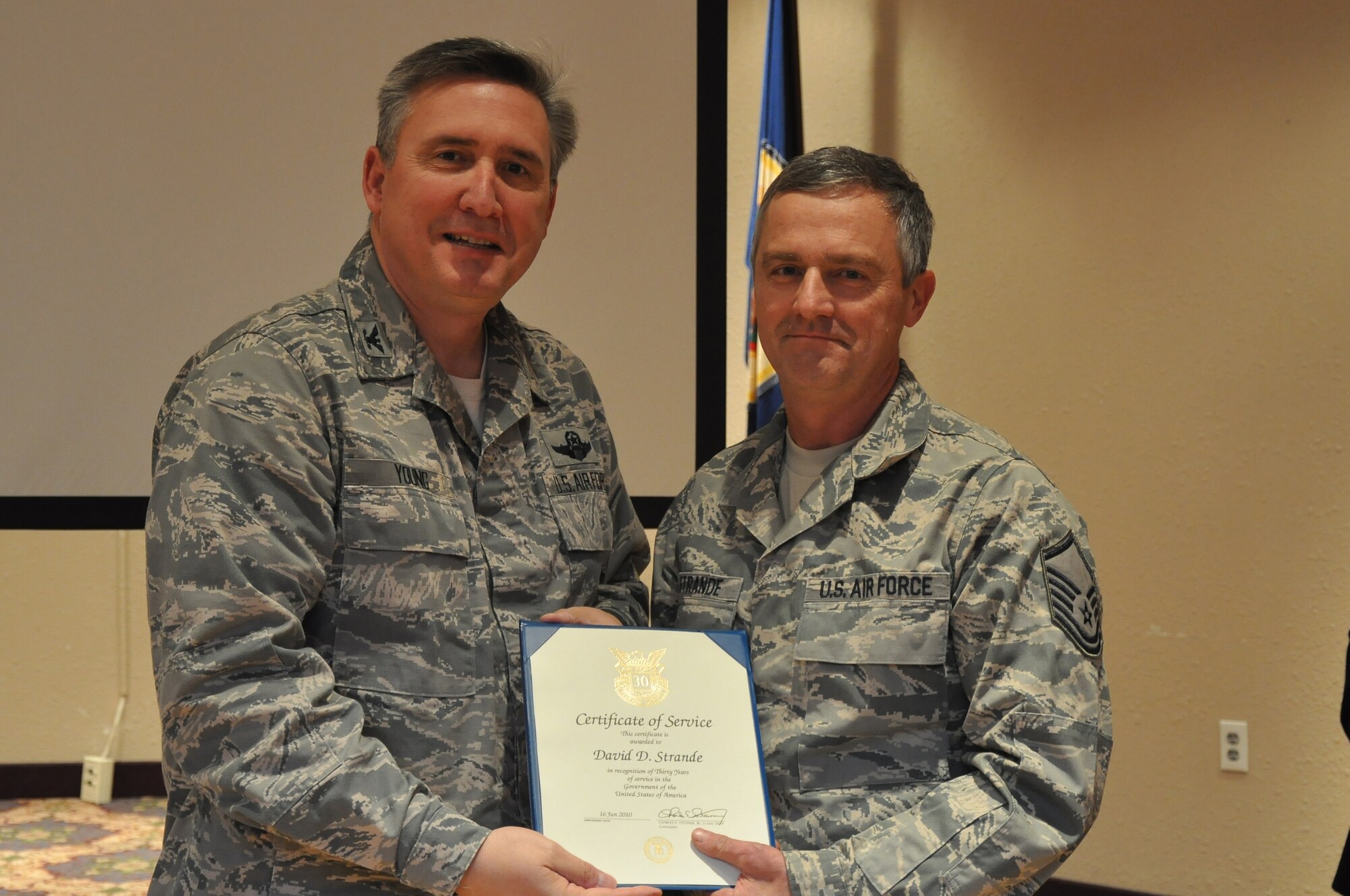 Colonol Darrell Young, 934th Airlift Wing Commander  presents 30 Service award to David Strande (Air Force Photo/TSgt Bob 