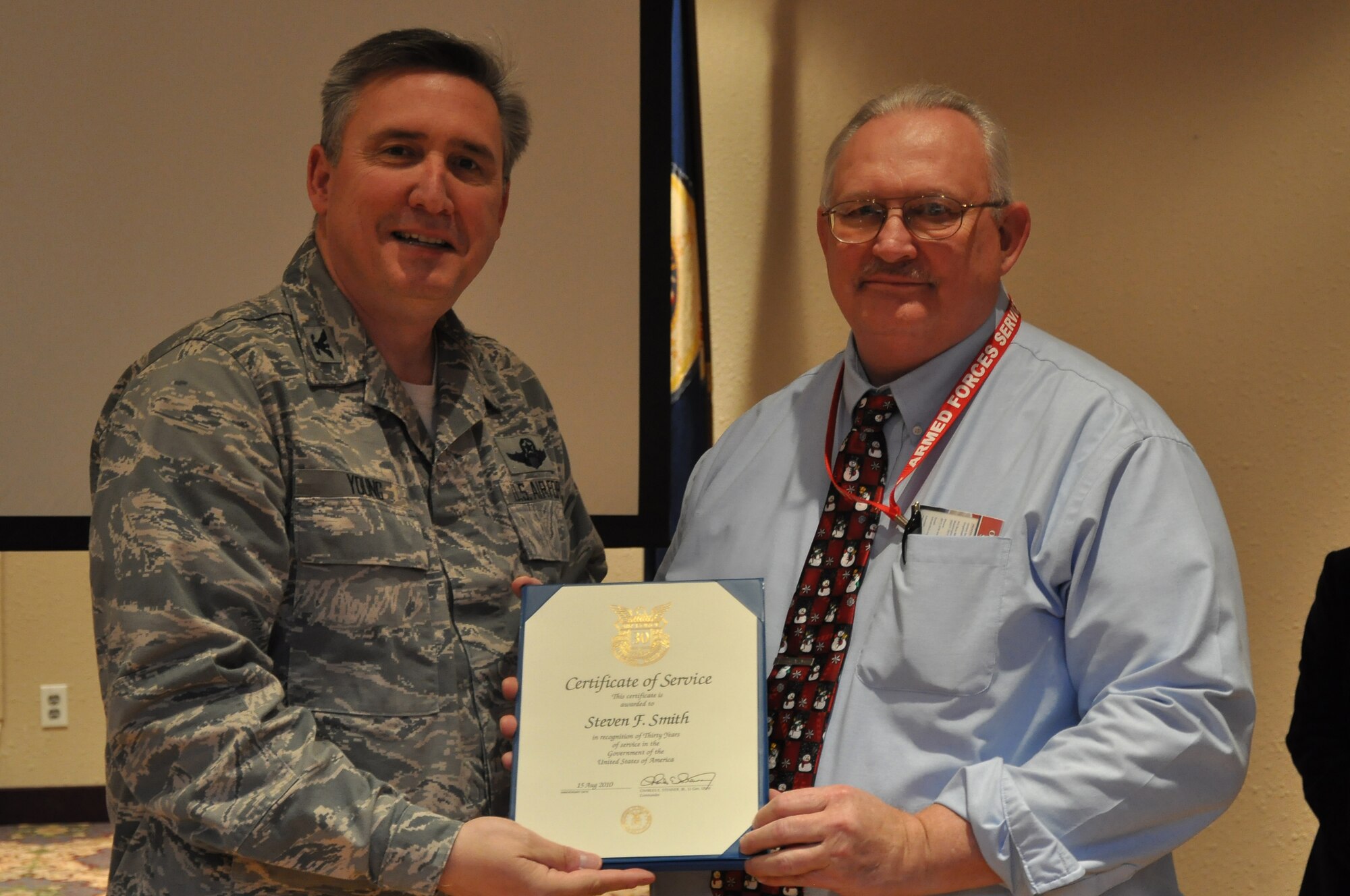 Colonol Darrell Young, 934th Airlift Wing Commander  presents 30 Service award to Steven Smith (Air Force Photo/TSgt Bob 